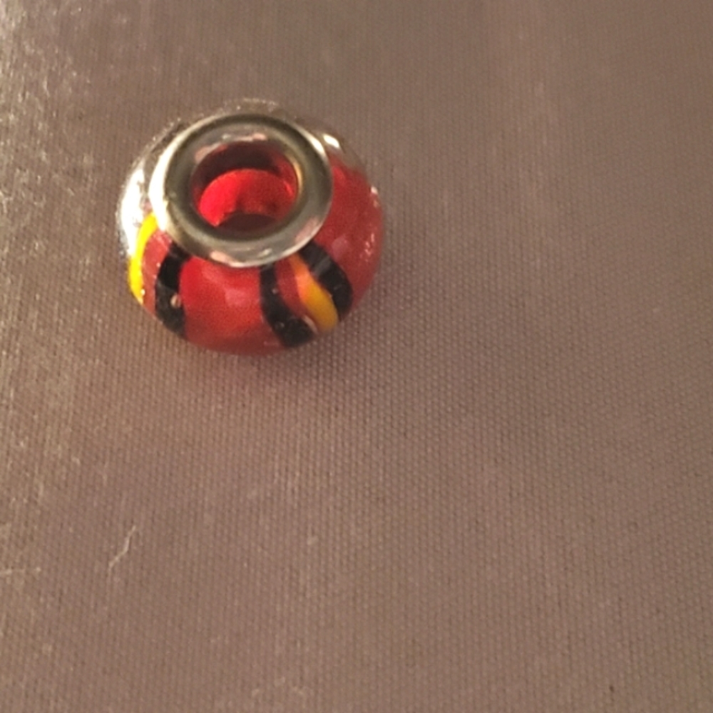 red, black & yellow charm